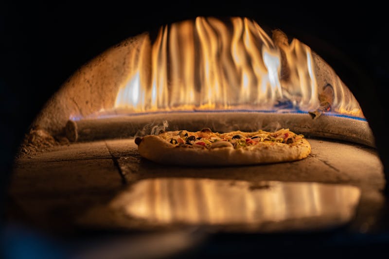 Wood-fired oven with glowing embers